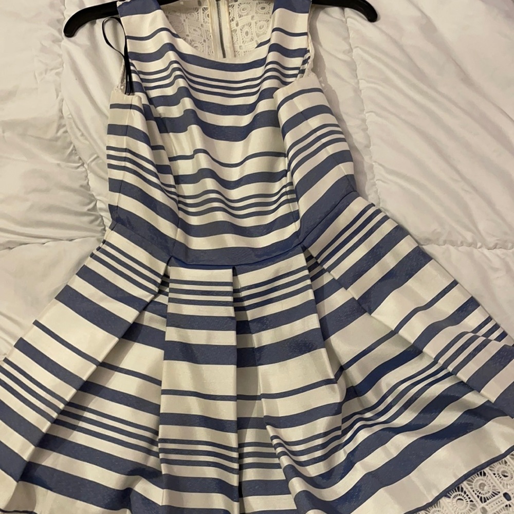 Blue and white sleeveless dress.